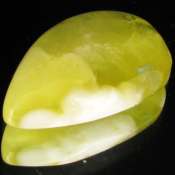 34.15ct Lemon Prehnite Cabochon: Excellent piece; well cut and colored; with treatment