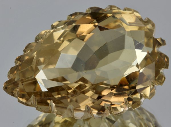 96.15ct Lemon Yellow Citrine Carved Cut: Excellent heated grade 9 of 10 specimen; estimated Gem Guide wholesale $35, estimated retail $100; Brazil origin