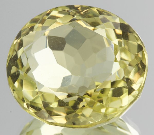 58ct Lemon Yellow Citrine Oval Cut: Excellent heated grade 9 of 10 specimen; estimated Gem Guide wholesale $35, estimated retail $100; Brazil origin