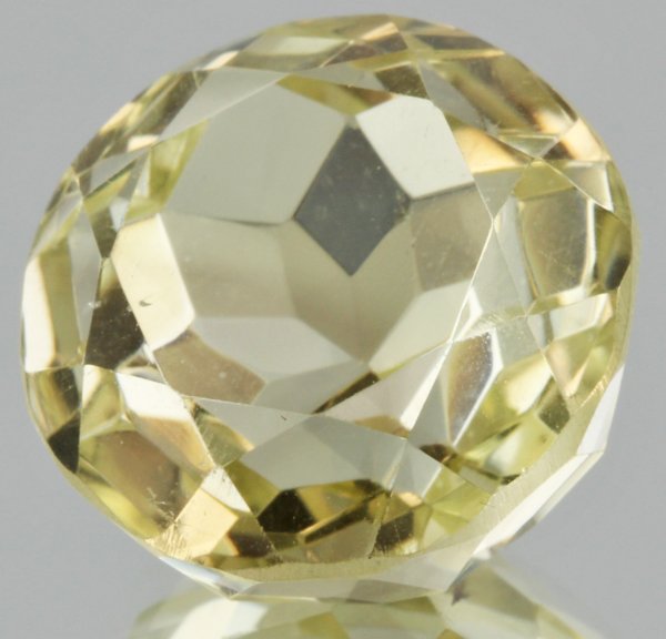 30ct Lemon Yellow Citrine Round Cut: Excellent heated grade 9 of 10 specimen; estimated Gem Guide wholesale $35, estimated retail $100; Brazil origin