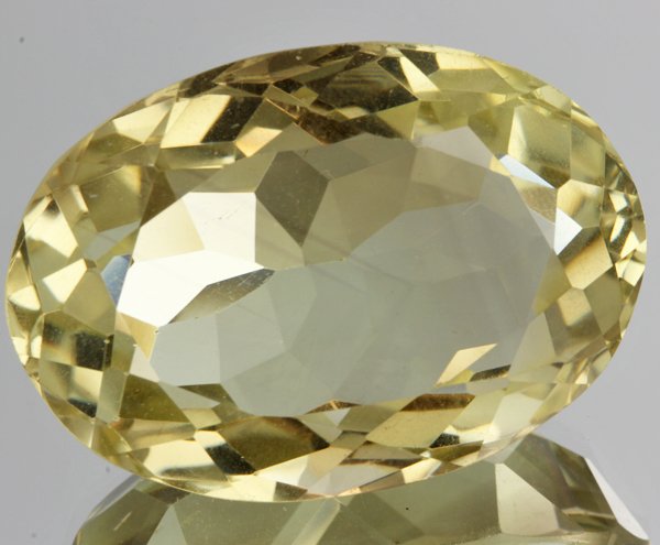 72.5ct Lemon Yellow Citrine Oval Cut: Excellent heated grade 9 of 10 specimen; estimated Gem Guide wholesale $35, estimated retail $100; Brazil origin