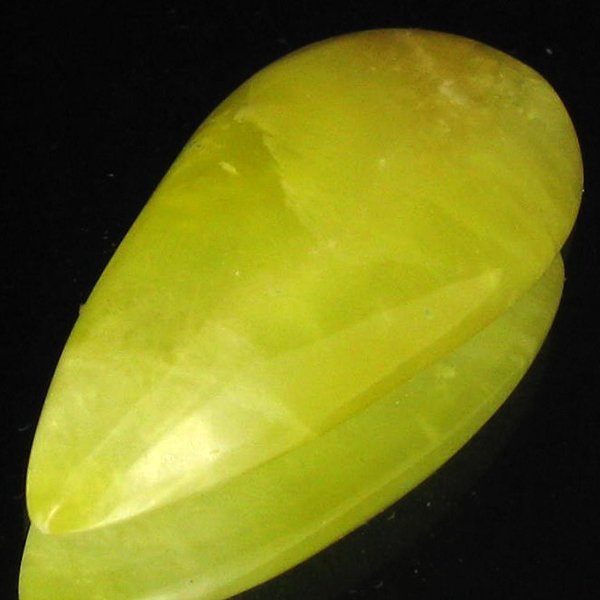 34.25ct Lemon Prehnite Cabochon: Excellent piece; well cut and colored; with treatment