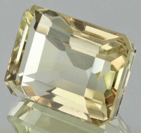 71.7ct Lemon Yellow Citrine Emerald Cut: Excellent heated grade 9 of 10 specimen; estimated Gem Guide wholesale $35, estimated retail $100; Brazil origin