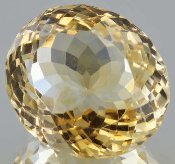 19.47ct Lemon Yellow Citrine Oval Cut: Excellent heated grade 9 of 10 specimen; estimated Gem Guide wholesale $35, estimated retail $100; Africa origin