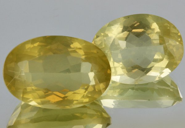29.55ct Lemon Yellow Citrine Oval Cut Pair: Excellent heated grade 9 of 10 specimen; estimated Gem Guide wholesale $35, estimated retail $100; Africa origin