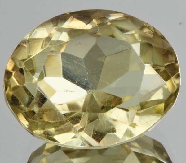 18.05ct Lemon Yellow Citrine Oval Cut: Excellent heated grade 9 of 10 specimen; estimated Gem Guide wholesale $35, estimated retail $100; Brazil origin