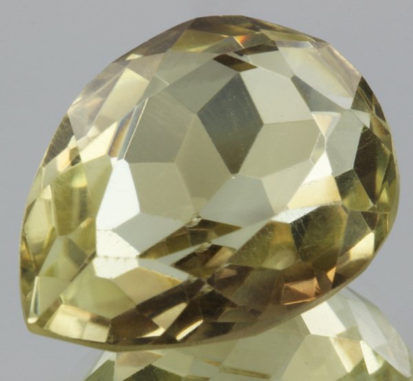 27.85ct Lemon Yellow Citrine Pear Cut: Excellent heated grade 9 of 10 specimen; estimated Gem Guide wholesale $35, estimated retail $100; Brazil origin