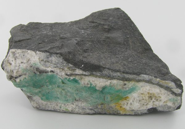 650ct Natural Colombian Emerald Crystal Cluster: Excellent specimen with pyrite crystals and small emerald crystal vein on base material
