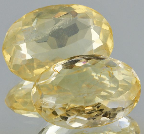 21.2ct Lemon Yellow Citrine Oval Cut Pair: Excellent heated grade 9 of 10 specimen; estimated Gem Guide wholesale $35, estimated retail $100; Africa origin
