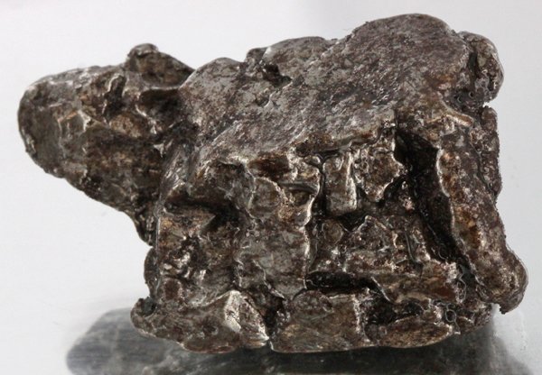 43gm Meteorite Campo Del Cielo Argentina: Scarce remnant of prehistoric (2000-4000bc) meteorite discovered in the 16th century; a main mass of 18 tons has been discovered along with a shower of smaller breakup fragments; cosmic age is young f