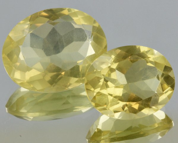 23.8ct Lemon Yellow Citrine Oval Cut Pair: Excellent heated grade 9 of 10 specimen; estimated Gem Guide wholesale $35, estimated retail $100; Africa origin