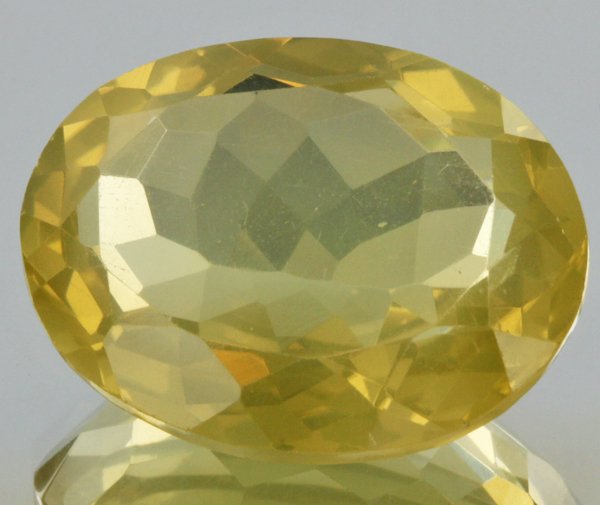 19.05ct Lemon Yellow Citrine Oval Cut: Excellent heated grade 9 of 10 specimen; estimated Gem Guide wholesale $35, estimated retail $100; Africa origin