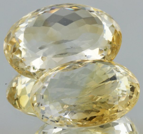 31ct Lemon Yellow Citrine Oval Cut Pair: Excellent heated grade 9 of 10 specimen; estimated Gem Guide wholesale $35, estimated retail $100; Africa origin