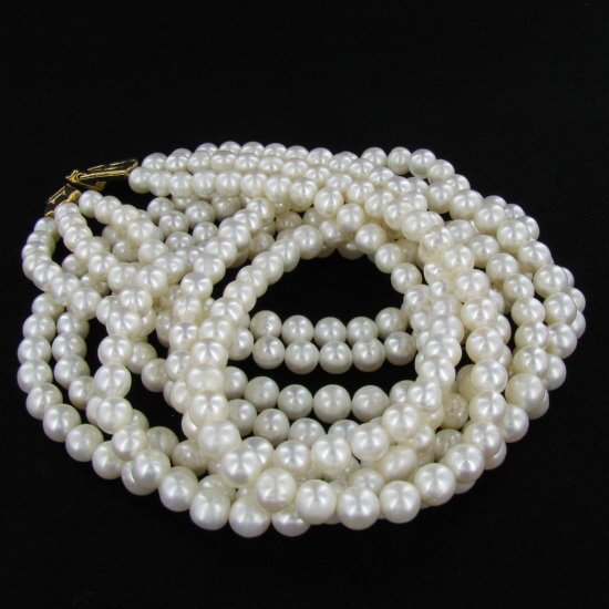 White Saltwater Pearl Three Strand Necklace: Excellent white saltwater pearls; uniformly sized (6.5mm); 330 count; 75" (25" 3 strands);