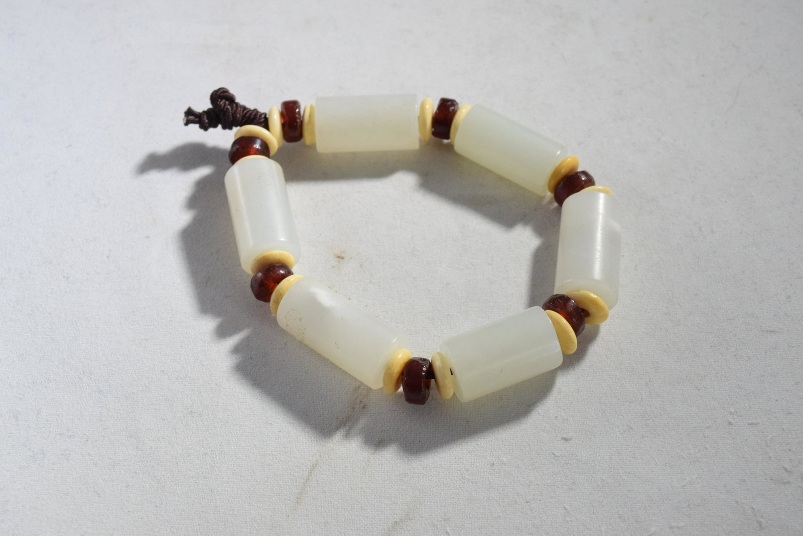 A Jade Bead Braclet: A Jade Bead Braclet 5.5cm wide, 36 grams