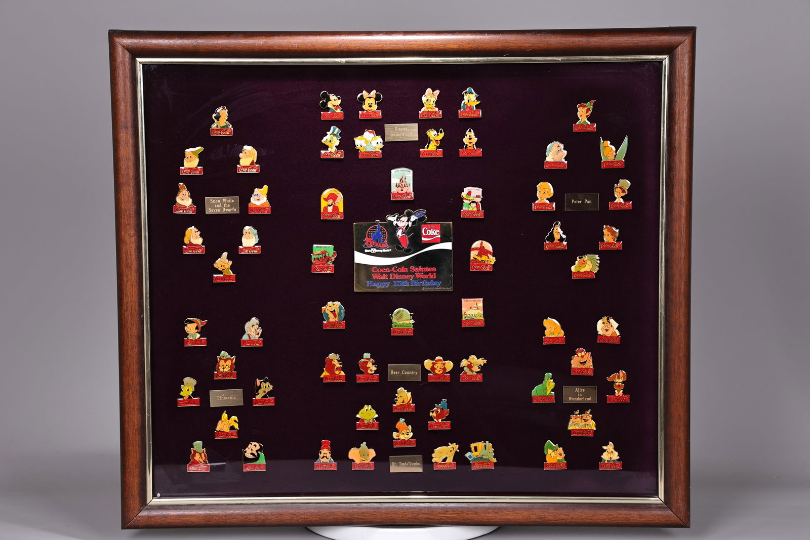 Coca Cola Walt Disney World 60 Pins 15th Anniversary Framed: Coca Cola Walt Disney World 60 Pins 15th Anniversary Framed (65 x 57.5 x 3 cm including frame)