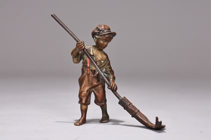 Vintage Vienna Bronze Style Figure Of A Young Boy Sweeping
