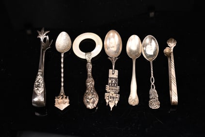 Collection Of Sterling Silver Souvenir Spoons, Tongs, Baby Rattle