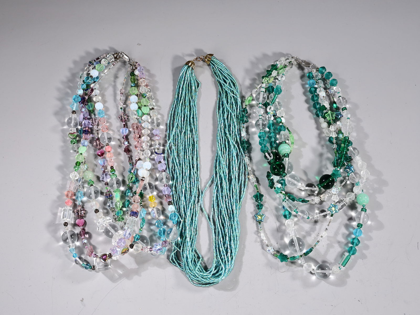 Three Multiple Strand Blue And Green Glass Beaded Necklaces: Three Multiple Strand Blue And Green Glass Beaded Necklaces (About 23 x 3 cm more or less)