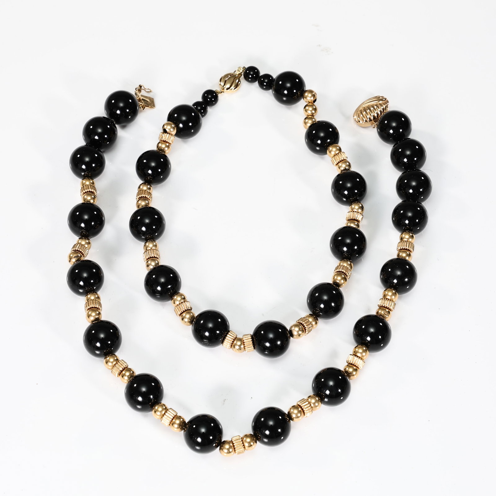 Two Black Onyx Beaded With 14k Yellow Gold Necklaces: Two Black Onyx Beaded With 14k Yellow Gold Necklaces (20.3 x 1.5 cm Total Length: 43 cm, 18 x 1.5 cm Total Length: 38 cm)