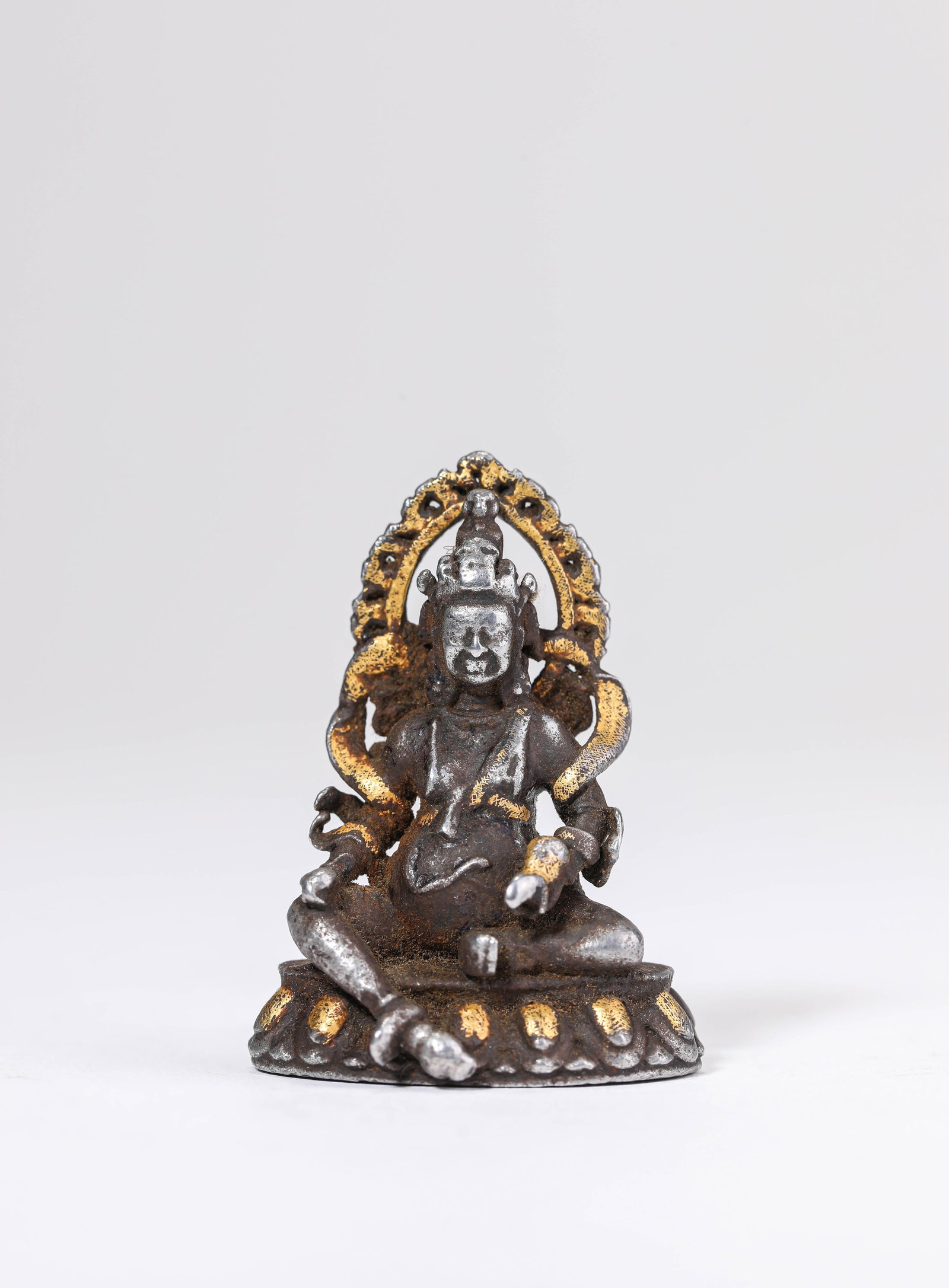 A Champlevé Enamel on Iron Figure of Yellow Jambhala: A Champlevé Enamel on Iron Figure of Yellow Jambhala Dimensions: Weight: 25 g. Length: 3 cm x Width: 2 cm x Height: 4.1 cm. All measurements are approximate.