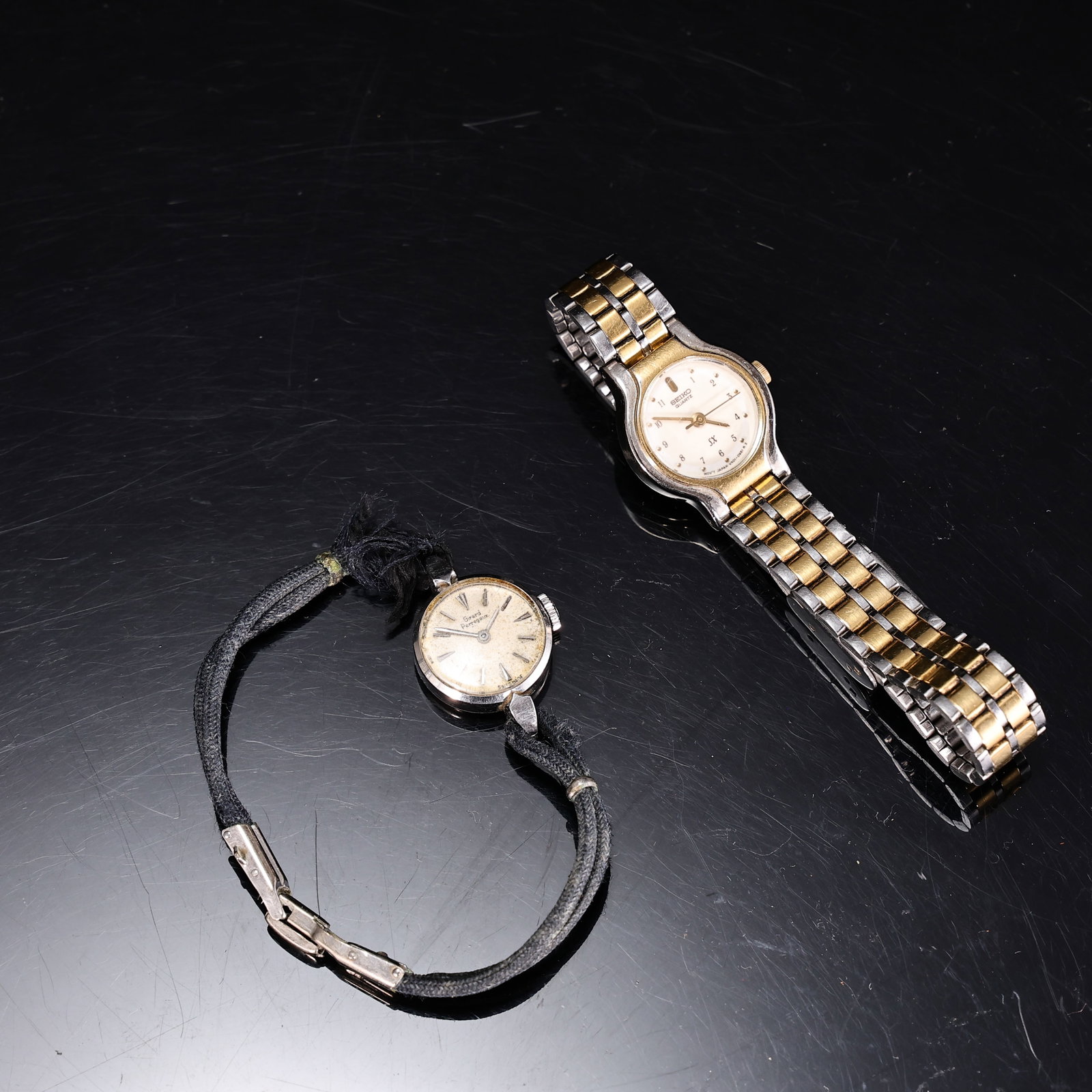 Vintage Wristwatches Including Seiko Quartz and Geneva Ladies Watch: Vintage Wristwatches Including Seiko Quartz and Geneva Ladies Watch (Watch: 2 x 2 cm, 1.5 x 1.5 cm) Condition: Vintage watch. Untested for timekeeping. May need repair, adjustment, or a new battery. S