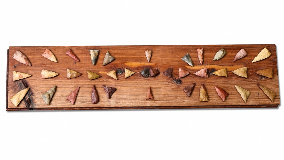 Native American Arrowheads On Wooden Display Board.: Native American Arrowheads On Wooden Display Board. (37 x 8.5 x 0.5 cm)