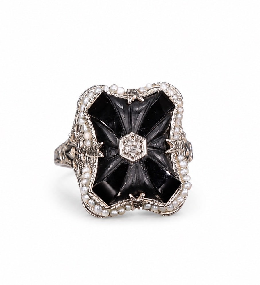Art Deco 14K White Gold Black Onyx, Seed Pearl Ring: Art Deco 14K White Gold Black Onyx, Seed Pearl Ring (Size:7.5 Weight: 5.3 grams) Vintage Art Deco Style Filigree Ring featuring a carved black onyx centerpiece, seed pearl halo, and a small central di