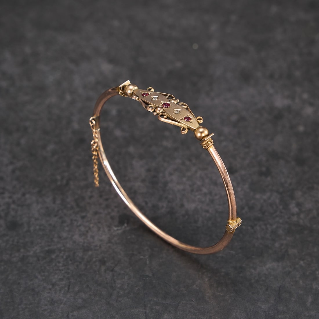 Victorian 10K,14K Gold Ruby & Diamond Hinged Bangle Bracelet: Victorian 10K,14K Gold Ruby & Diamond Hinged Bangle Bracelet (Circumference 5.5 x 5.3 cm, Weight: 4.3 grams)
