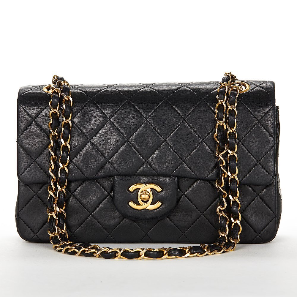 Chanel Black Lamb Skin Leather Quilting 2.55 Chain Bag: Diamond quilting, leather and chain strap, front flap closure, coco mark turnlock closure, main compartment, internal slip pocket, internal zip pocket, internal logo, internal slip pocket, silver-tone