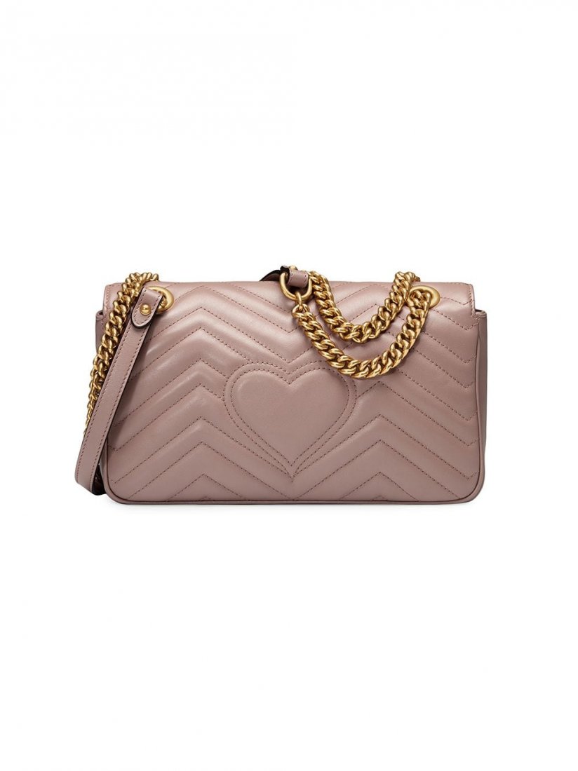 Gucci GG Marmont matelassé shoulder bag: The medium GG Marmont chain shoulder bag has a softly structured shape and an oversized flap closure with Double G hardware. The sliding chain strap can be worn multiple ways, changing between a shoul