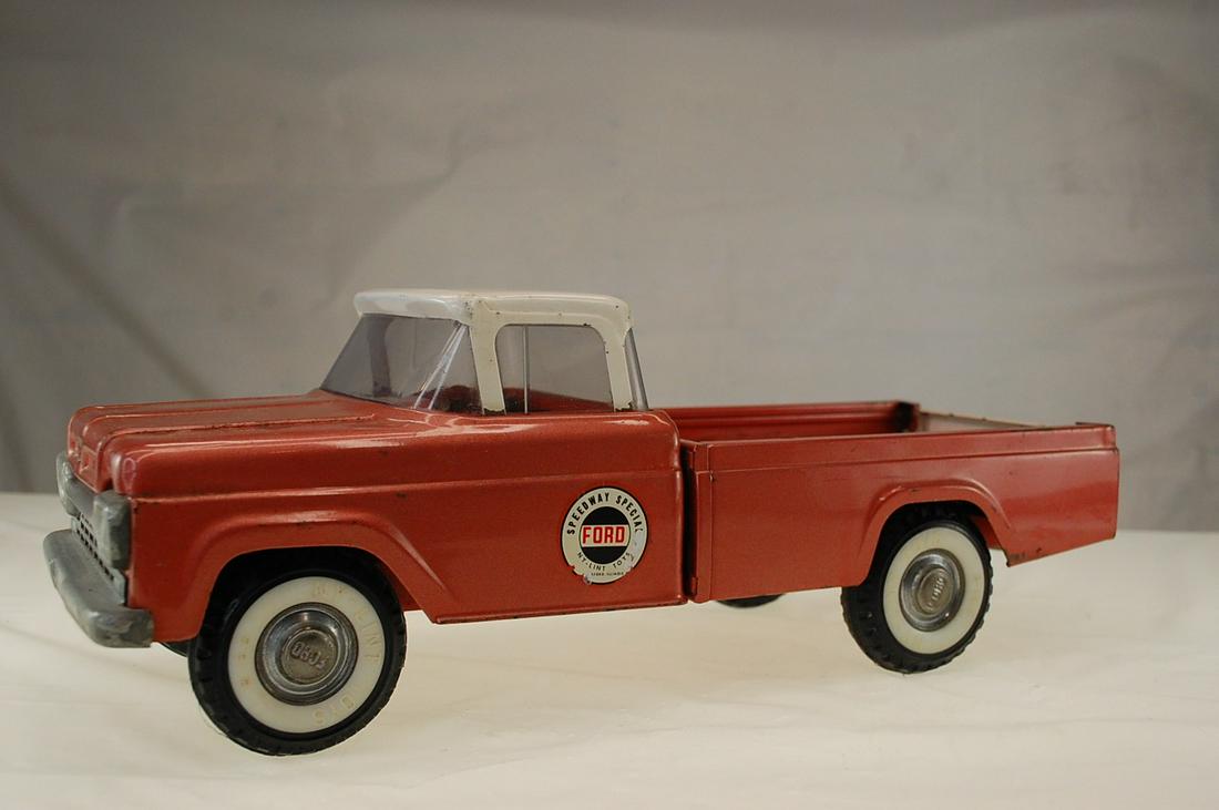 VINTAGE NY LINT FORD SPEED WAY SPECIAL TRUCK: 24" inches long vintage Ny lint Ford speedway special truck. There are some rust spots on the roof, as shown in picture. The stickers on the doors have some ware again shown in pictures. Also there is
