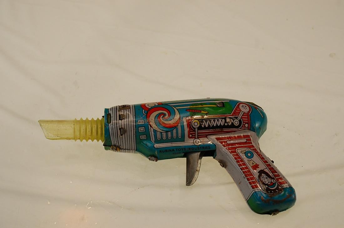 WORKING, EXCELLENT CONDITION RUBINA TIN FRICTION SPACE: This Rubina tin friction space gun was made in India, all red sparking windows present, and the friction works like new. This gun makes the rat tat tat sound that the toy space guns of the late 60's m