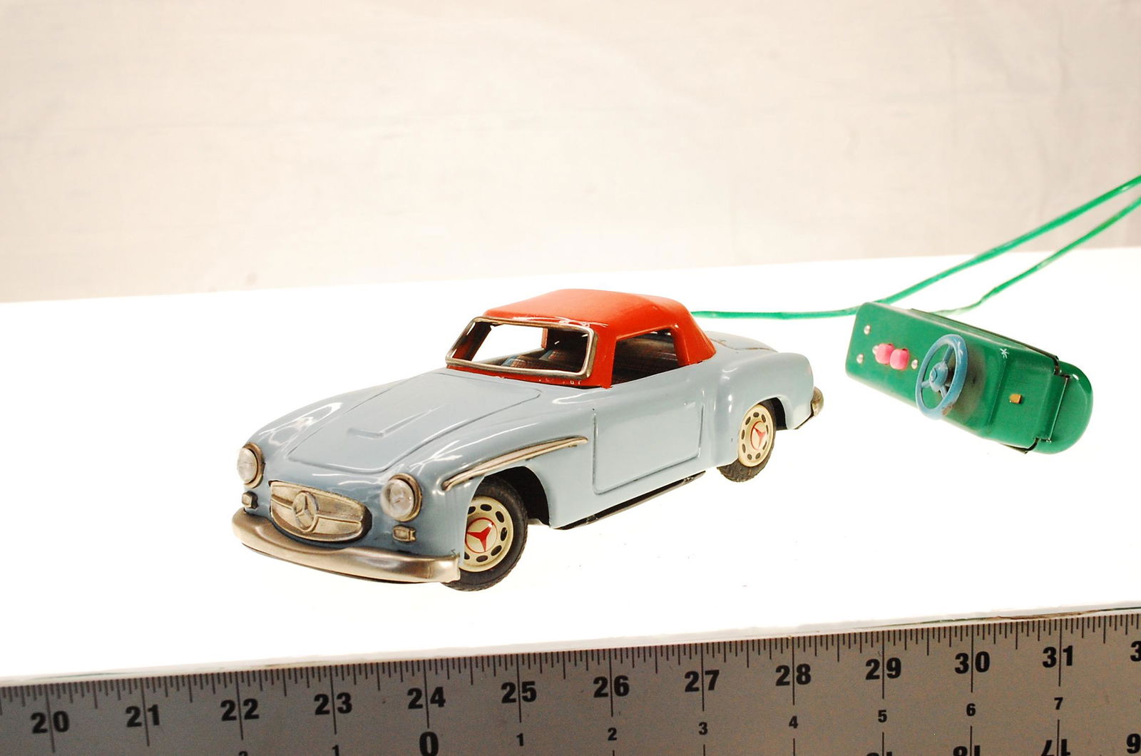 VINTAGE REMOTE CONTROL MERCEDES BENZ TIN CAR W/ RUBBER (1 of 4)