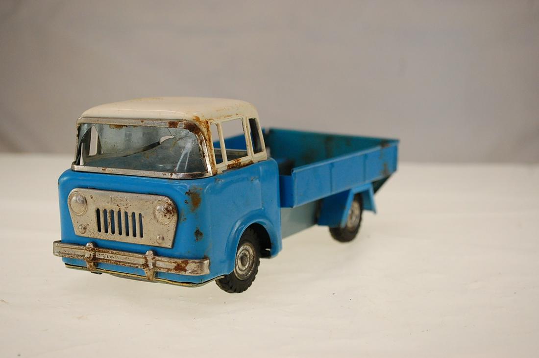 SCARCE VINTAGE JAPAN BANDAI TIN FRICTION JEEP 4 WHEEL: This is a vintage tin friction Jeep 4-Wheel Drive truck, made in Japan with the "B"(Bandai) trademark, otherwise in excellent condition, with a great front wheel drive friction mechanism, truck is abo