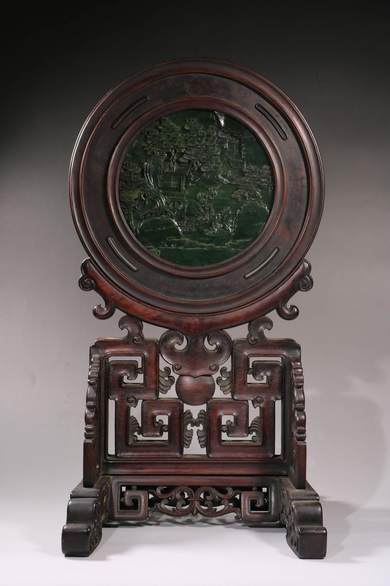 A Chinese round table screen with a spinach green-jade (1 of 9)