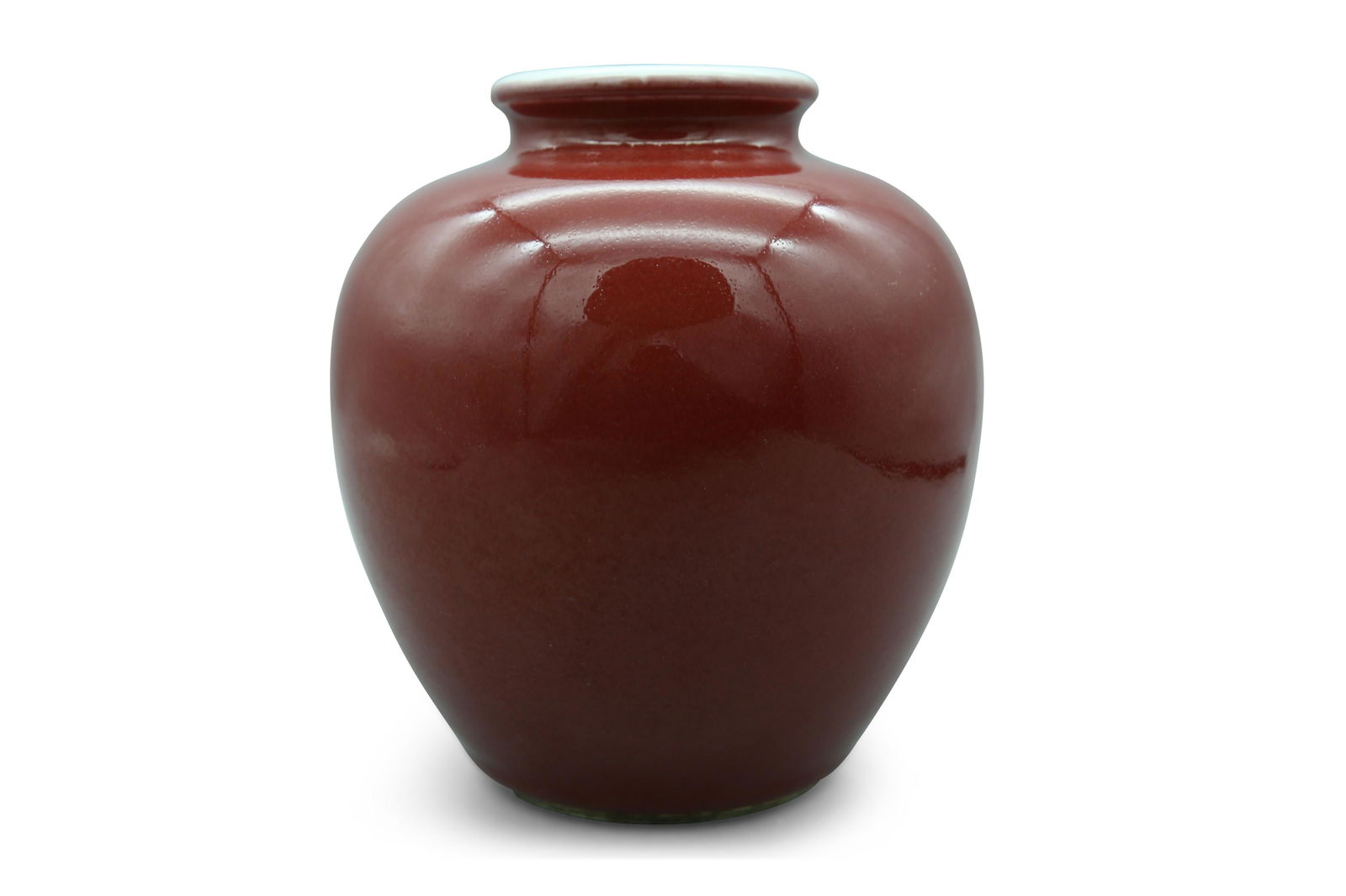 A monochrome red-glazed jar, H 16,5 cm (1 of 4)