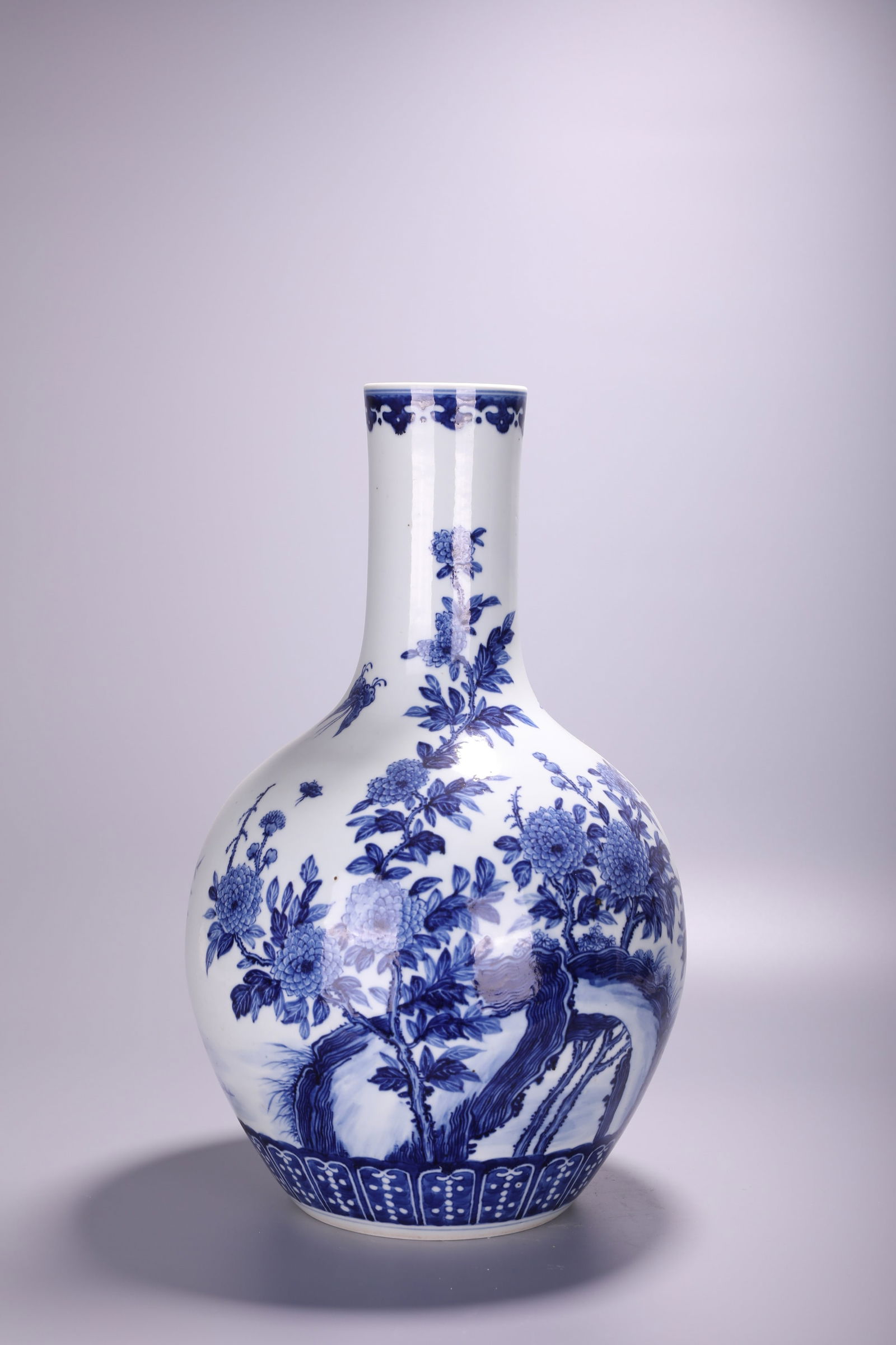 A Chinese blue and white 'Flower garden' tianqiuping bottle vase, H 45 cm (1 of 3)