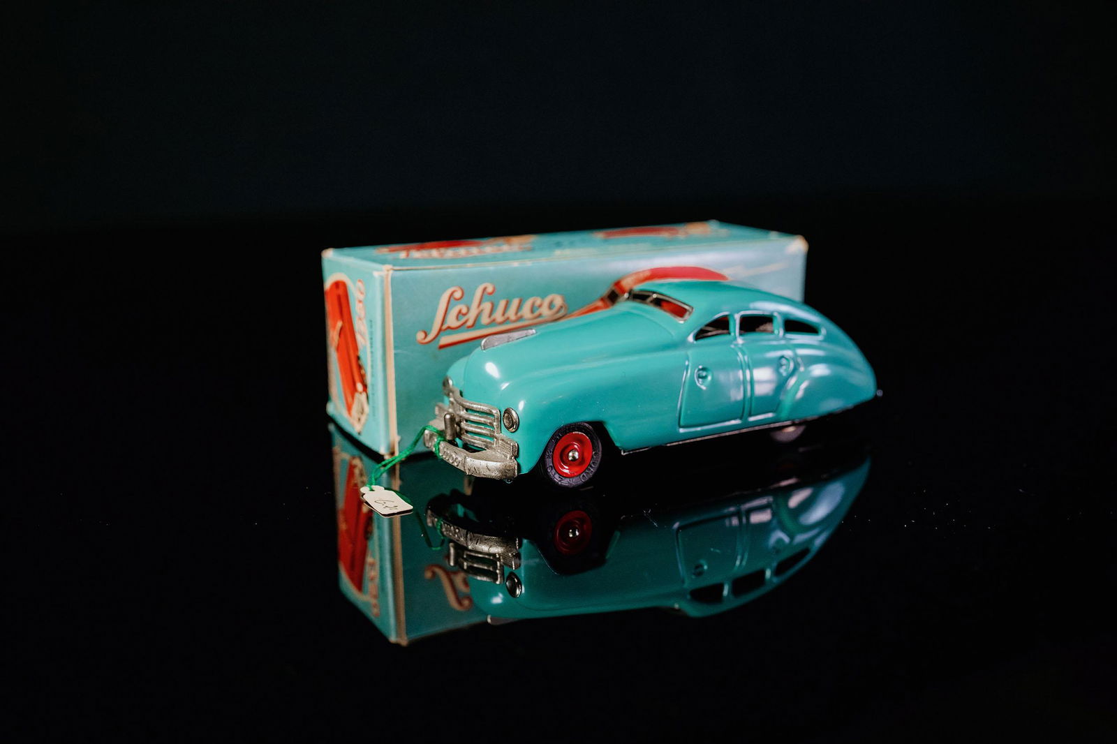 Schuco Garagenauto 1750: Tin toy, clockwork drive, function tested, hand-painted, turquoise, U.S. - Zone, 1955-1962, L 14,5 cm, mint, perfect condition, chrome parts very good, base plate lithographed, box perfect, descriptio