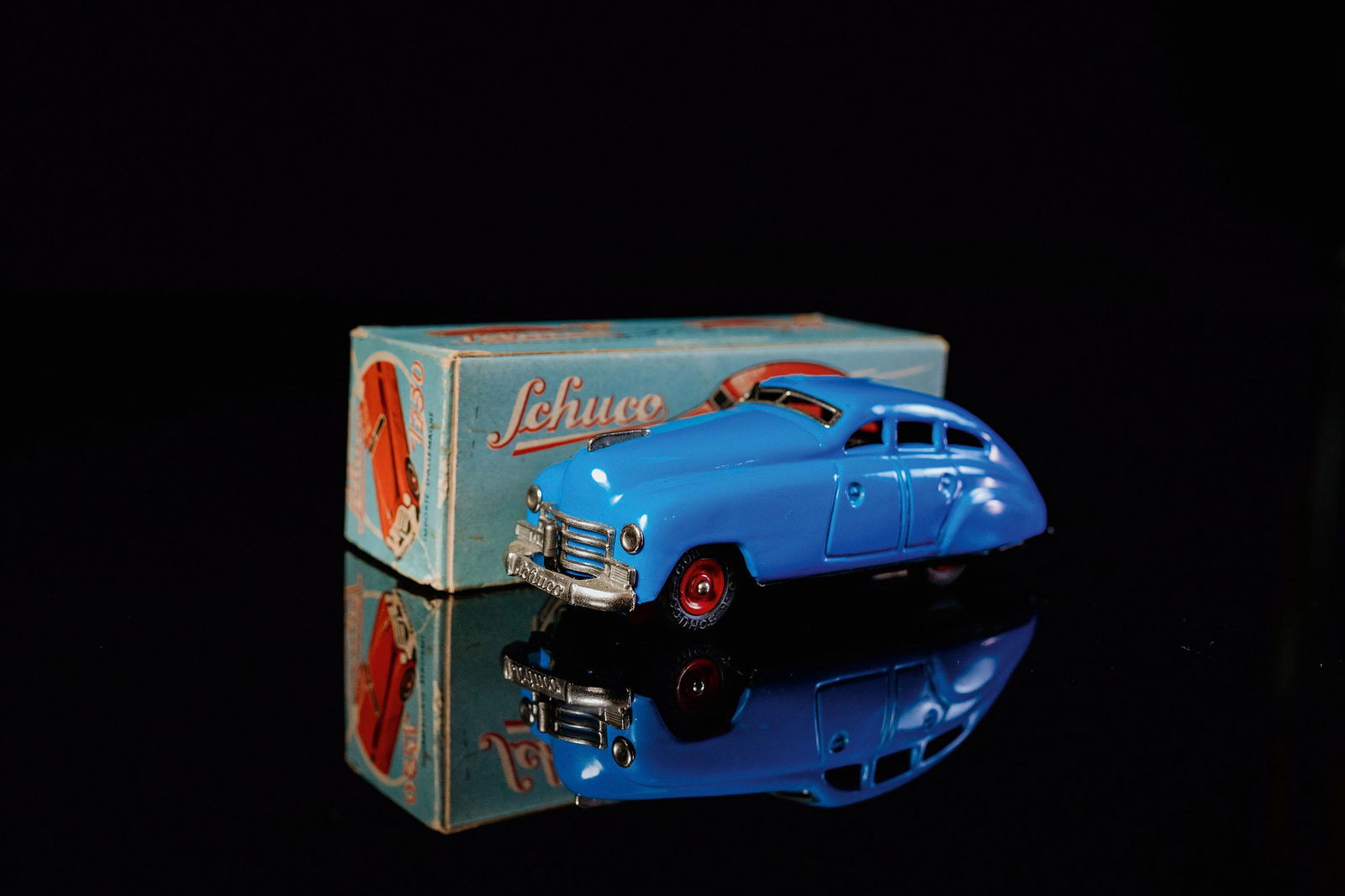 Schuco Garagenauto 1750: Tin toy, clockwork drive, function tested, hand-painted, blue, U.S. - Zone, 1955-1962, L 14,5 cm, as new, very good condition, chrome parts very good, base plate lithographed, box perfect, description