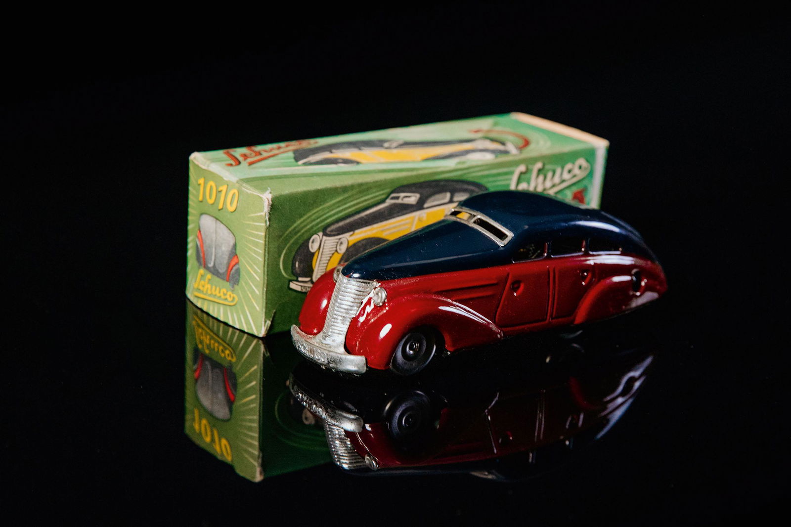 Schuco 1010 Maybach Wendelimousine: Tin toy, clockwork drive, function tested, hand-painted, black-blue/ wine-red, Made in U.S. - Zone, around 1950, L 14,5 cm, good condition, chrome perfect, base plate lithographed, embossed lettering