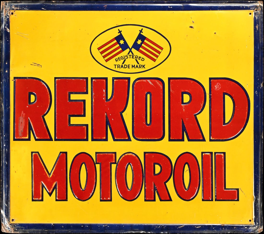 REKORD MOTOROIL | 24" TIN SIGN: Tin sign, embossed and lithographed, 1920s, 60 x 52 cm, an emblem featuring flags strongly reminiscent of Texas or Puerto Rico, presumably indicating the origin of this motor oil from the early days o