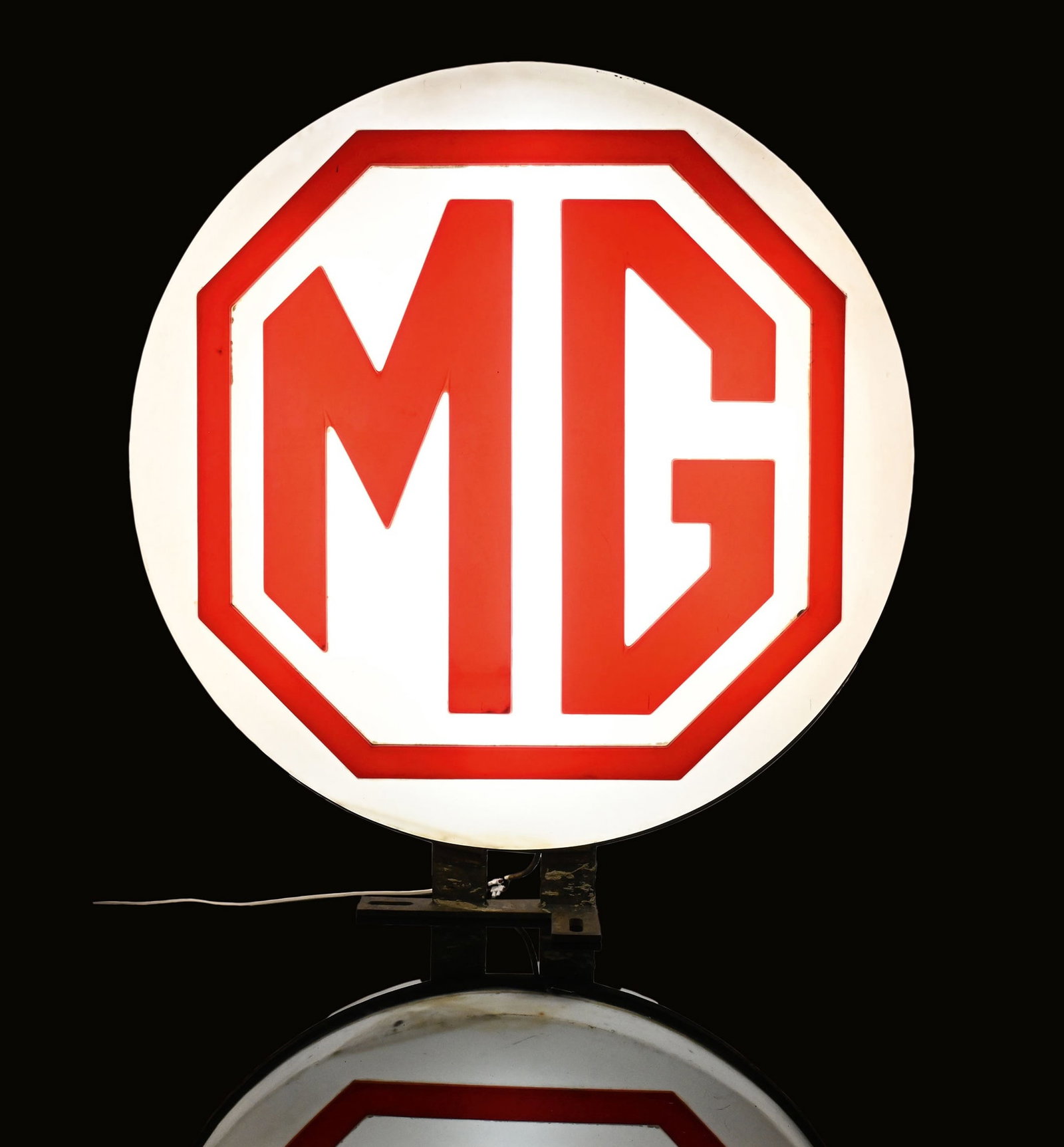MG | 39" LIGHTED SIGN: Old neon advertising, double-sided, plastic embossed in relief, 1960s, diam. 100 cm, fully functional, (the neons renewed as LED), with the original wall mount, the plastic body can be twisted so that