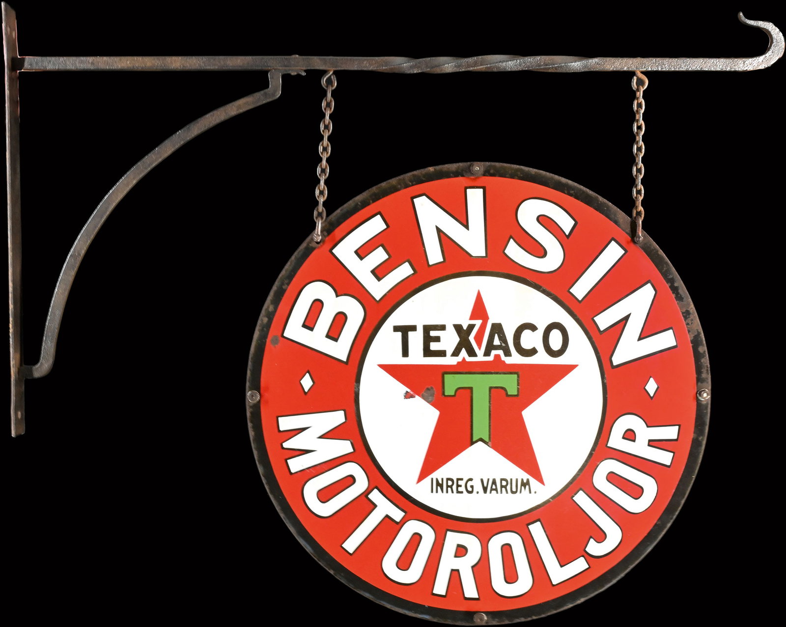 TEXACO | TWO 43" PORCELAIN SIGNS WITH BRACKET | A RARE & AUTHENTIC FIND: Flange consisting of two enamel signs attached on the original iron mount, the signs convex and stenciled, SWE around 1930, diam. 65 cm each, total measurements: 110 x 90 cm, a consignment that reache