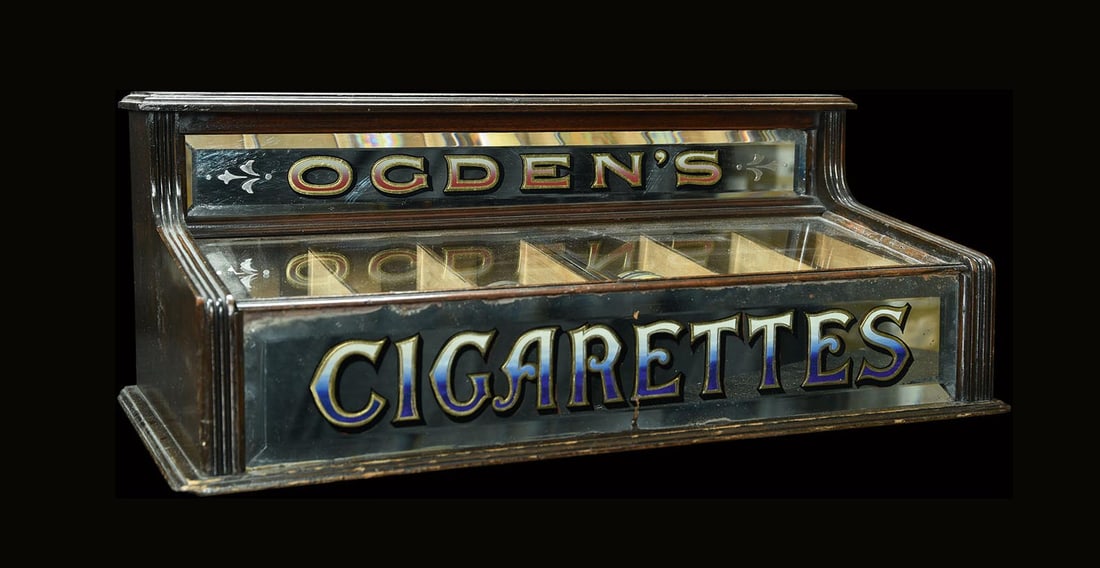OGDEN'S | VENDING DISPLAY | (1-2): Old vending display, wood, glass panels with reverse glass print, two drawers with 3 shelves each, filled with various tin cans of British cigarette brands, GB around 1905, 62 x 33 cm, H 25 cm, very r