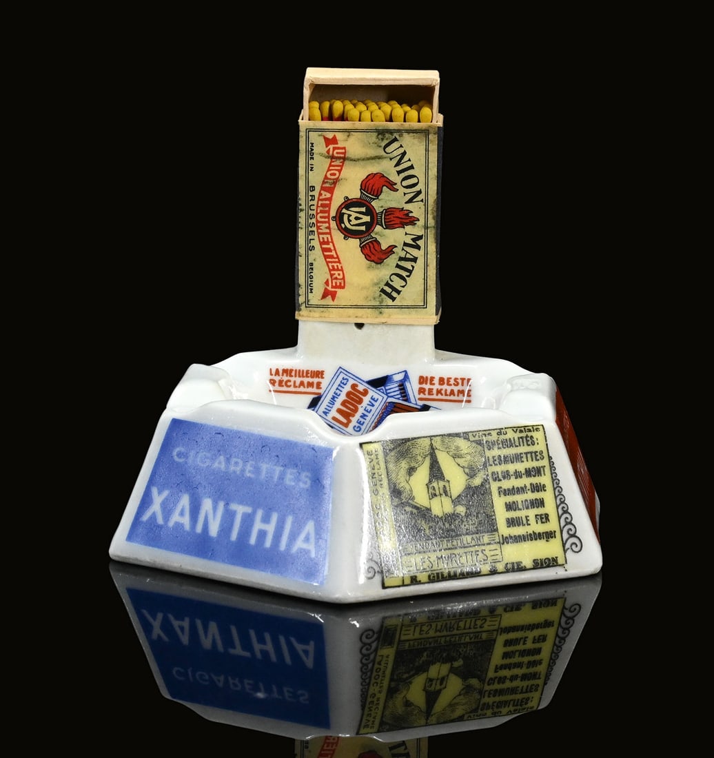 CIGARETTES XANTHIA | ASHTRAY | (2+): Ash tray, porcelain, CH 1930s, 12 x 14 cm, H 6 cm, Langenthal, Suisse, the bottom with a tear, rare | We do only sell old original pieces - no reproductions or fakes. We pack in house, most items can 