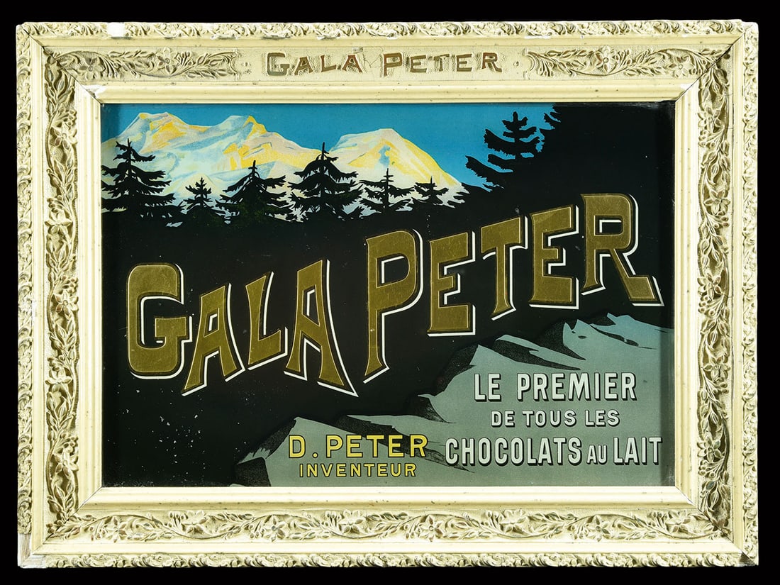 GALA PETER | PITTORESQUE GLASS ADVERTISING SIGN | (1): Early reverse glass lithograph in wooden frame, stucco decoration, Vevey/CH around 1900, 49 x 37 cm, wonderful original condition, the golden lettering seems to jump out of the image, first sun rays c