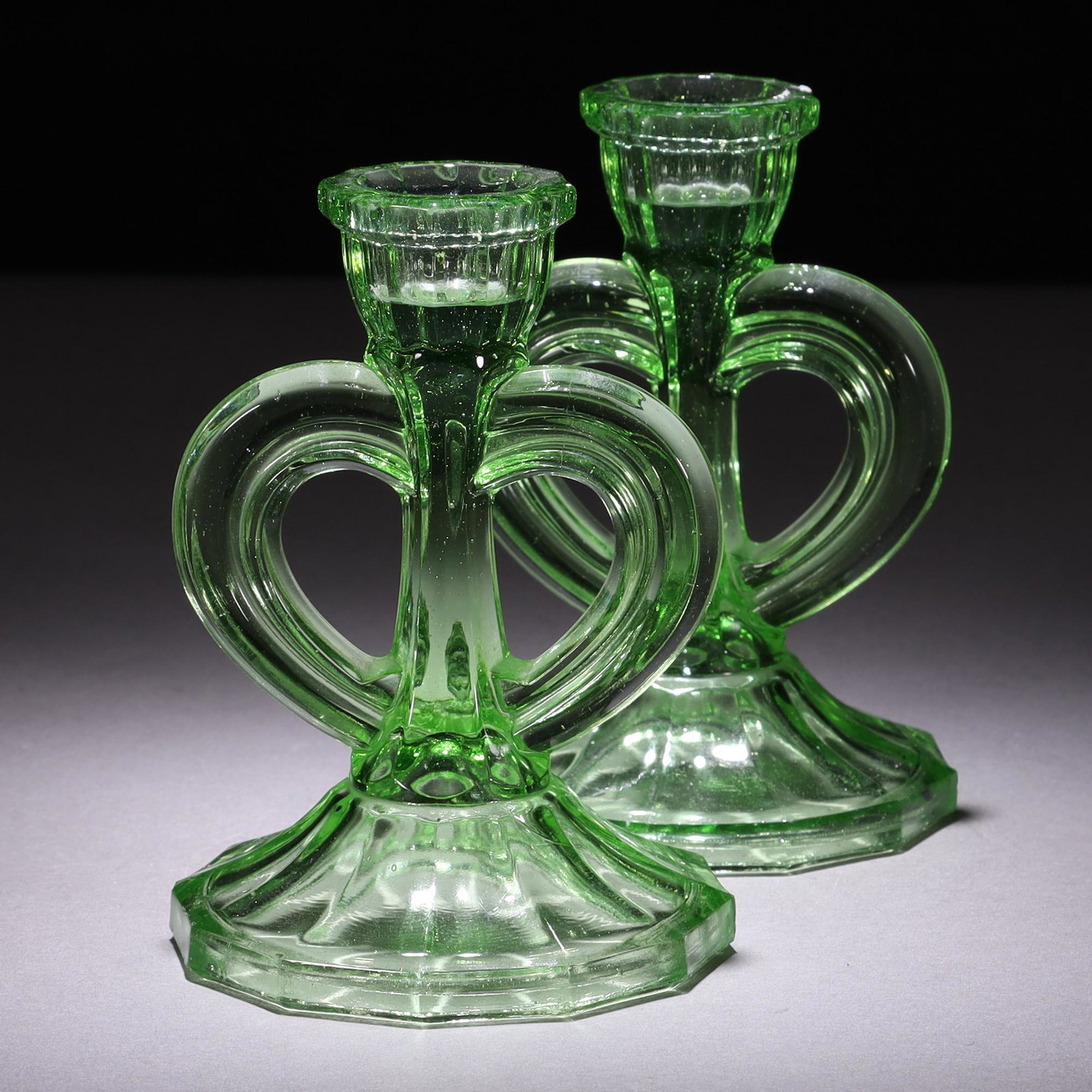 Uranium Glass Pair of Art Deco Candlesticks: MEASURING APPROX 13.5 X 9CM. Please carefully study all photographs to get an accurate idea of the object. In good condition, as seen. Shipping is in-house and we ship internationally to US and rest o
