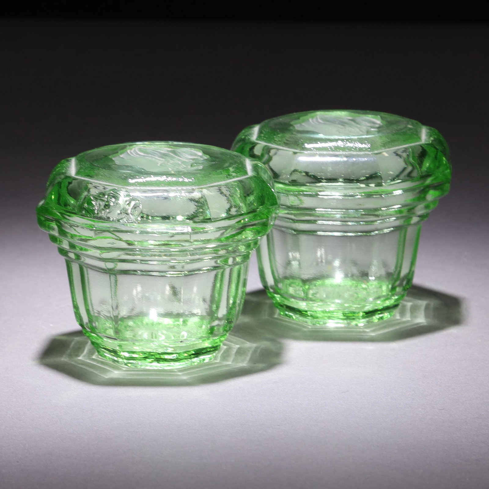 Uranium Glass Pair of Intaglio Faces Art Deco Lidded Jars: MEASURING APPROX 7.5 X 6.5CM. Please carefully study all photographs to get an accurate idea of the object. In good condition, as seen. Shipping is in-house and we ship internationally to US and rest 