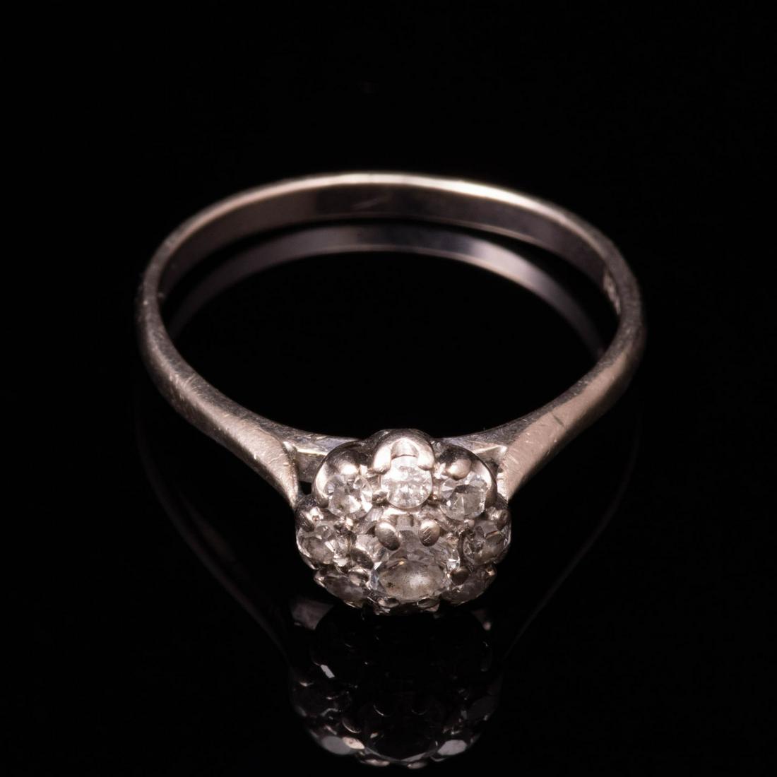 18 kt. White Gold 0.50 ct Diamond Cluster Ring: Please study all photographs carefully to get an accurate representation of the item. Please message us for information on dimensions/condition report. We offer in-house shipping internationally (US a